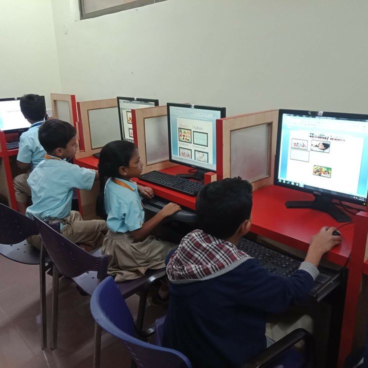 Students learning mathematics in classroom at Colours School