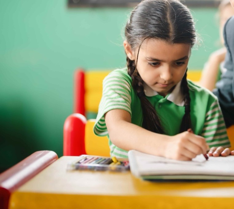 Students learning computers in school lab at Colours International School